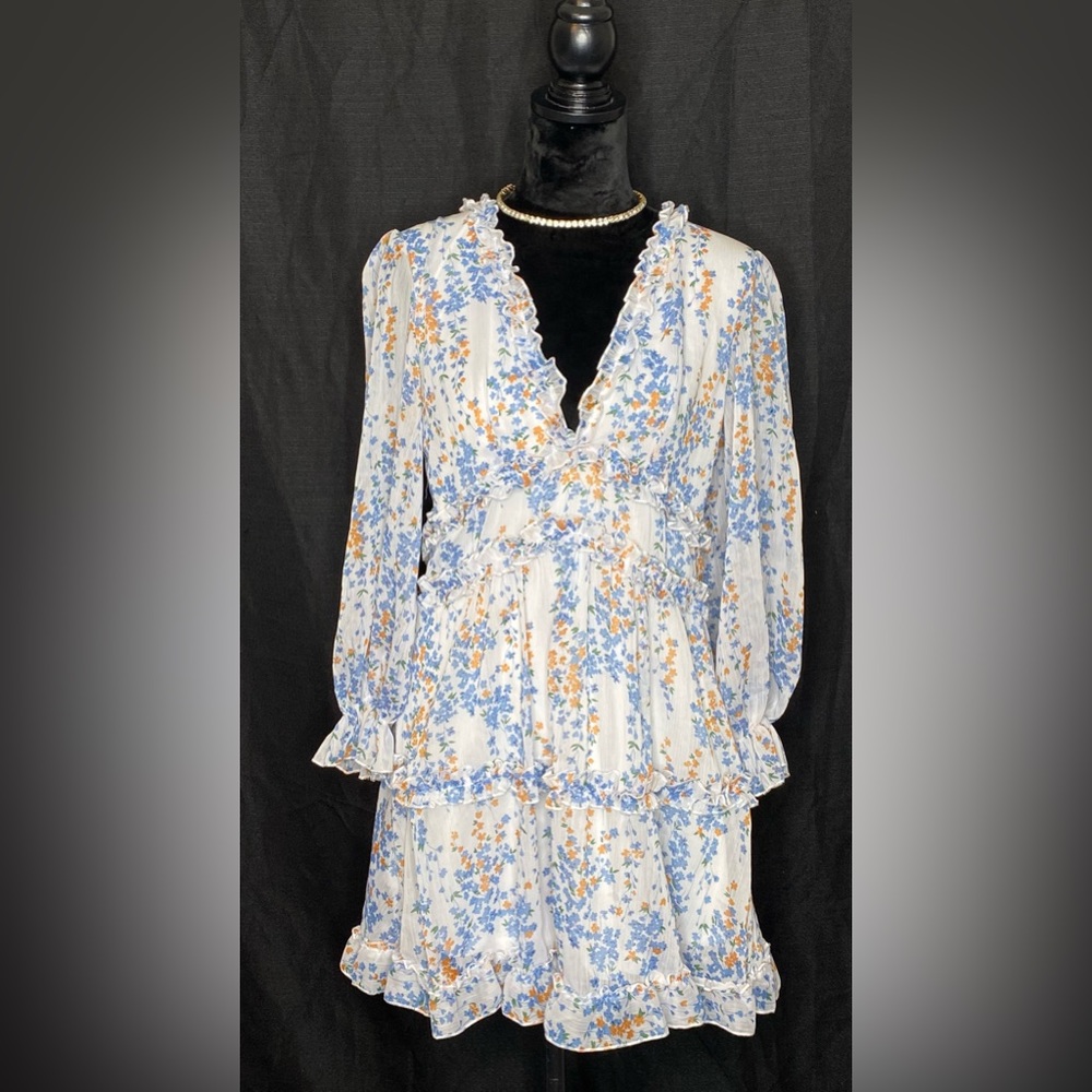 White and blue floral keyhole back dress with ruffle trim